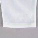 A white fabric with yellow stitching.