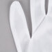 A close up of a pair of white Cordova Inspector's gloves.