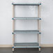 A MetroMax Q shelving unit with three shelves in a room.