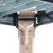 A close-up of a white MetroMax Q shelving unit.