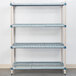 A MetroMax Q metal shelving unit with three shelves.