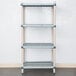 A white MetroMax Q shelving unit with blue shelves and wheels.