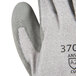 A close-up of a medium Cordova HPPE glove with gray polyurethane palm coating.