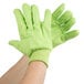 A pair of hi-vis yellow Cordova jersey work gloves with green stitching on a white background.