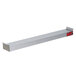 A white rectangular metal object with a long red label and red toggle buttons.