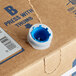 A blue and white box of Narvon Unsweetened Iced Tea Syrup with a blue cap on top.