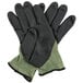 A pair of Cordova black and green heavy duty work gloves with a black foam nitrile palm coating.