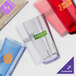 A group of light amber Cambro plastic tumblers with different designs.