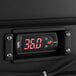 An Avantco black glass door back bar refrigerator with a digital display.