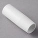 A white PVC pipe on a gray surface.