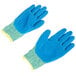 A pair of medium Cordova blue and yellow cut resistant gloves with blue crinkle latex palms.