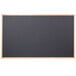 An Aarco black chalk board with an oak frame.