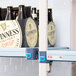 A MetroMax Q shelving unit in a grocery store aisle with Guinness beer on the shelves.