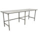 An Advance Tabco stainless steel work table with an open base and metal legs.