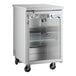 An Avantco stainless steel back bar refrigerator with a glass door.