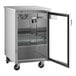 An Avantco stainless steel back bar refrigerator with glass doors and shelves.
