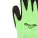 A close-up of a Cordova Hi-Vis Lime glove with black foam nitrile palm coating.