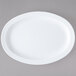 A white oval platter on a gray surface.