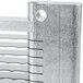 A close-up of a metal blade assembly with holes in it.
