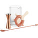 An Acopa cocktail stirring glass with a copper spoon and strainer.