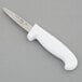 A Choice paring knife with a white handle.