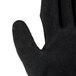 A close up of a pair of Cordova Hi-Vis green and black gloves with latex palms.