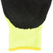 A yellow and black Cordova Monarch work glove with a black foam latex palm.