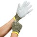 A pair of large Cordova Power-Cor Max cut resistant gloves with yellow and green trim on a person's hands.