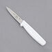 A Choice paring knife with a white handle.