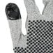 A close up of a pair of Cordova Monarch gray gloves with two-sided black nitrile dots.