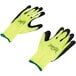 A pair of yellow and black Cordova warehouse gloves with green foam latex palms.