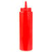 A close-up of a red plastic Choice squeeze bottle with a lid.