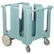 A blue plastic Cambro dish cart with wheels for 4 columns of dishes.