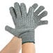 A pair of Cordova gray grip gloves with criss-cross PVC coating on the palms and fingers.