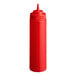 A red plastic wide mouth squeeze bottle with a pointed nozzle cap.