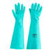 A pair of green Cordova nitrile gloves.