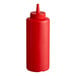 A red plastic squeeze bottle with a pointed nozzle lid.