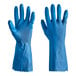 A hand wearing a blue Cordova latex rubber glove.