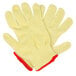 A pair of yellow Cordova Aramid / Cotton work gloves with red trim.