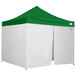A green and white Caravan Canopy Alumashade Bigfoot instant canopy with side walls.