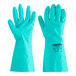 A gloved hand wearing a Cordova Nitrile Green glove with a label.