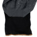 A pair of black Cordova warehouse gloves with black and gray palms and nitrile dots.