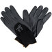 A pair of Cordova black work gloves with black foam and nitrile dots on the palms.