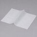 Durable Packaging interfolded deli wax paper on a gray surface.