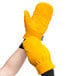 A pair of yellow freezer mittens with black leather double palms.