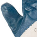 A close up of a blue Cordova Nitrile glove with a white and blue surface.