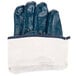 A pair of Cordova blue fabric gloves with white lining.