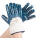 A pair of blue Cordova smooth nitrile gloves with blue and white jersey lining.