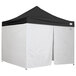 A black and white Caravan Canopy with a black top and white walls.