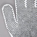 A Cordova white work glove with black dots on the palms.